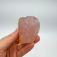 In-hand view of a Rose Quartz specimen kept near for Love, from Madagascar.
