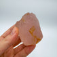In context of a Rose Quartz specimen, associated with Emotional Healing, with character of the piece on display.