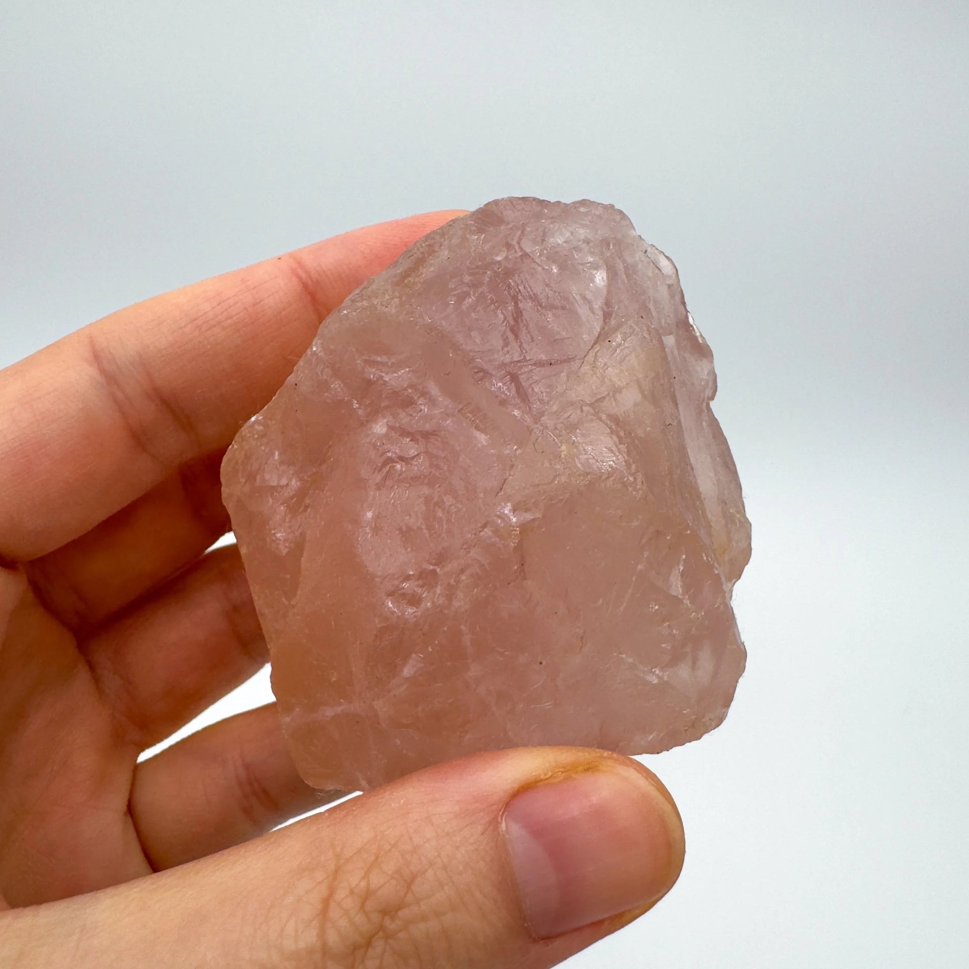 Back view of Grade AAA Rose Quartz specimen showing natural surface