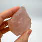 Detail shot of Grade AAA Rose Quartz specimen under natural light