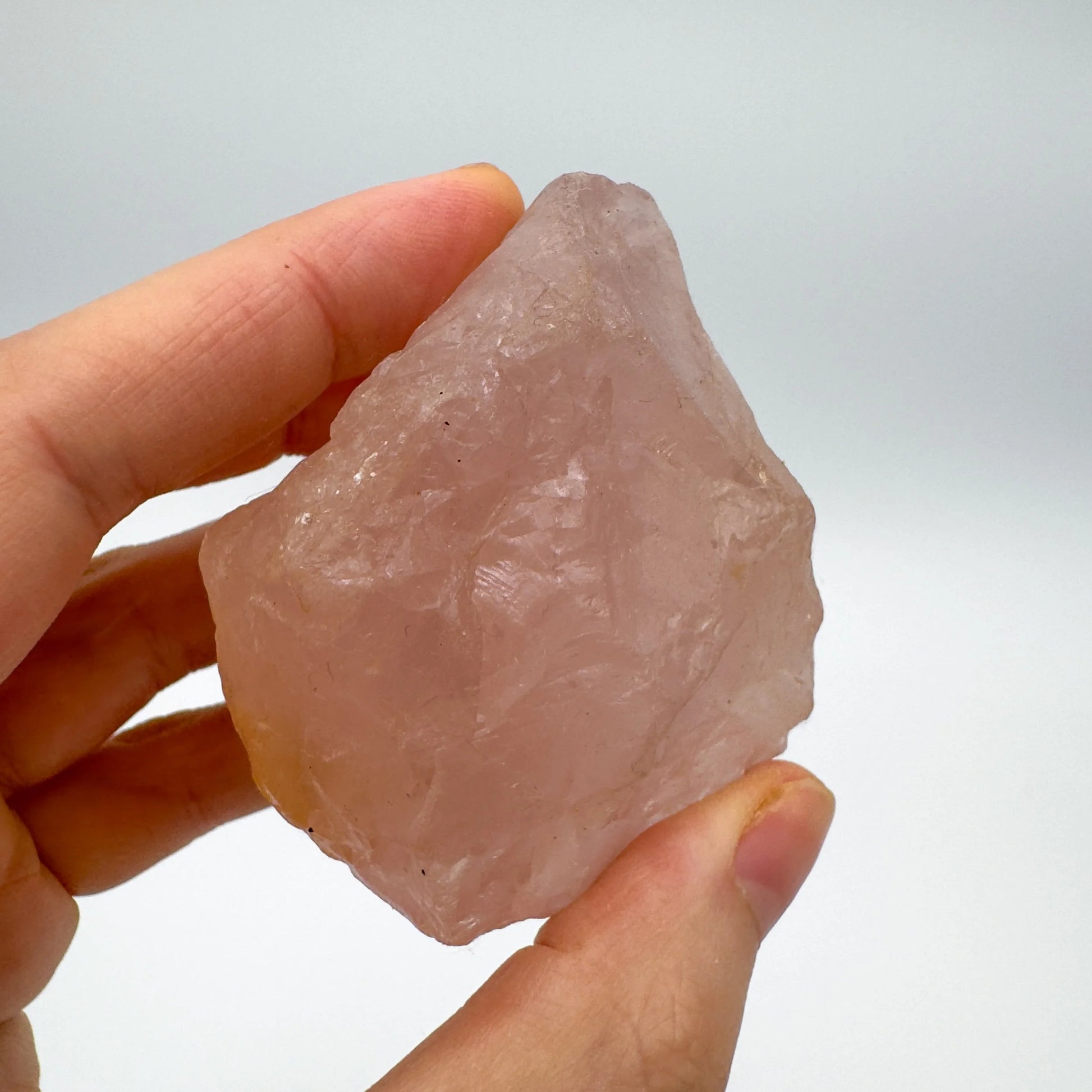 Detail shot of Grade AAA Rose Quartz specimen under natural light