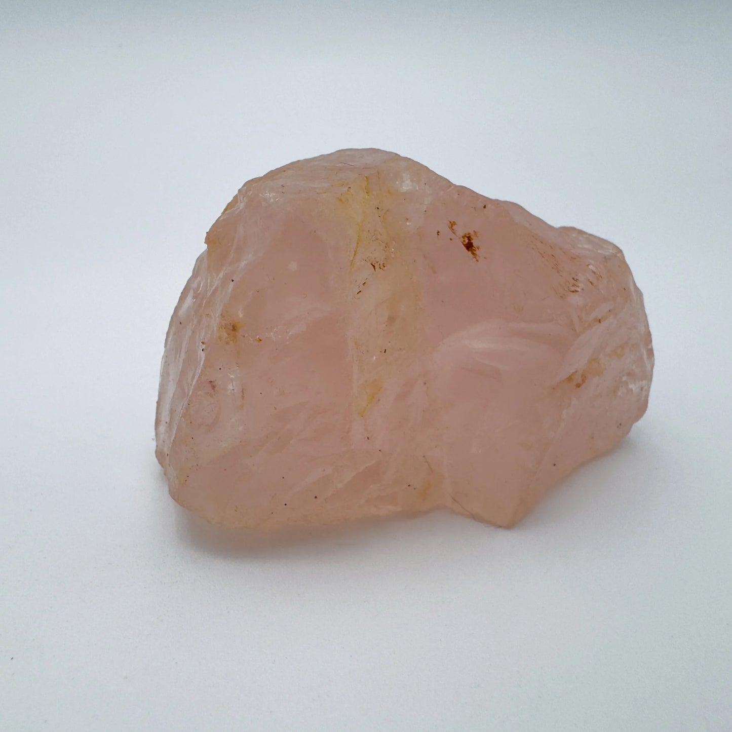 Back view of Grade AAA Rose Quartz specimen showing natural surface