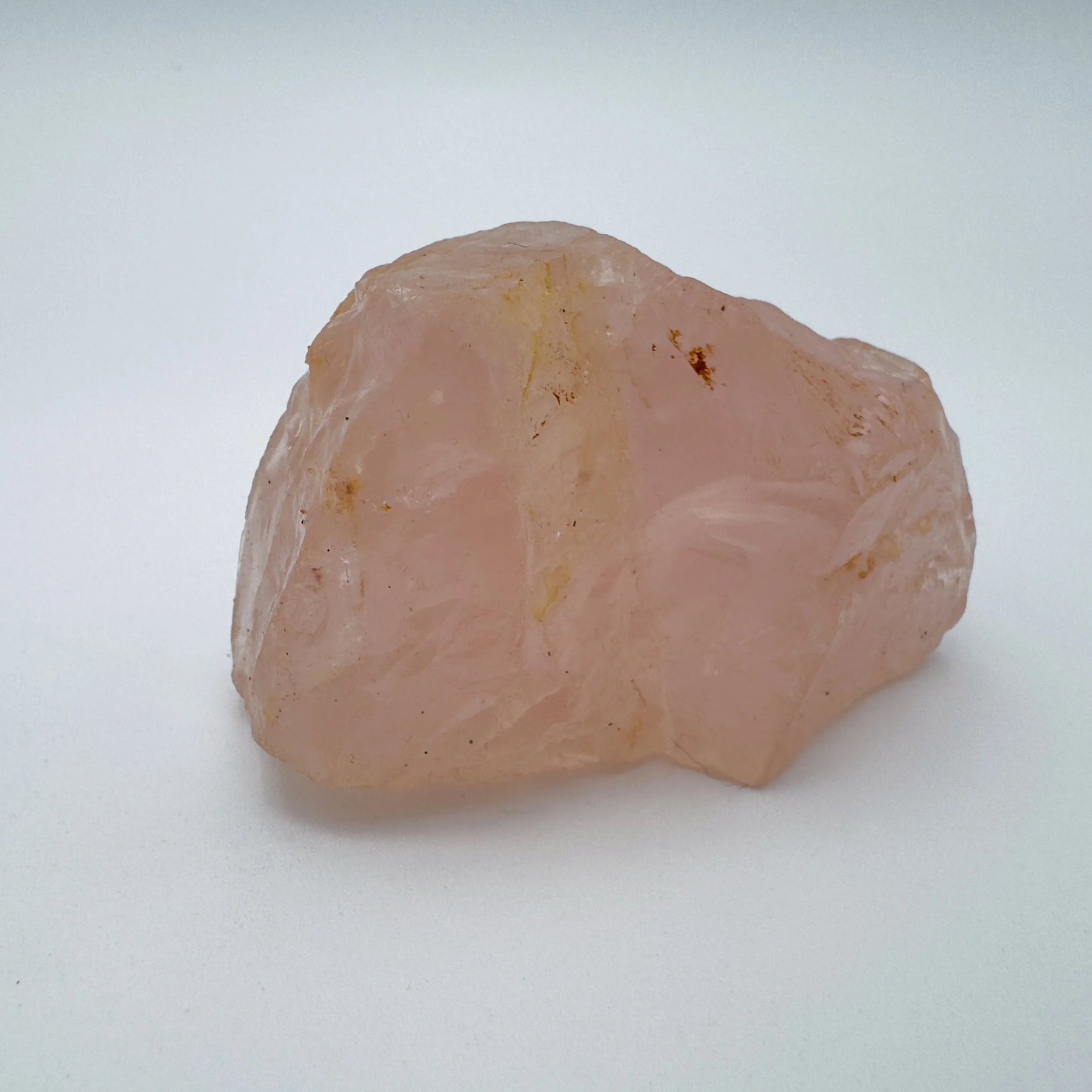 Back view of Grade AAA Rose Quartz specimen showing natural surface