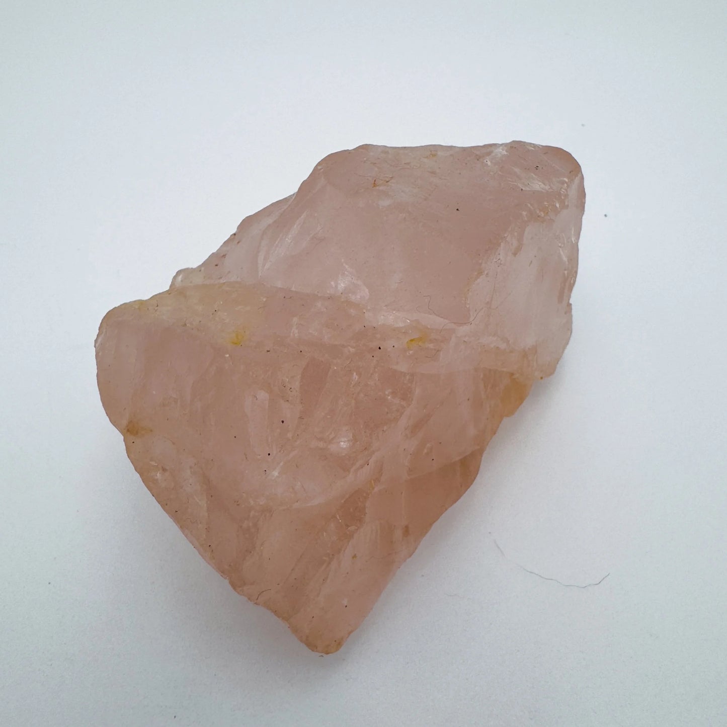Detail shot of Grade AAA Rose Quartz specimen under natural light