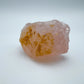 Edge view of Grade AAA Rose Quartz specimen, often worked with for Love and Self Love, showing raw matrix.