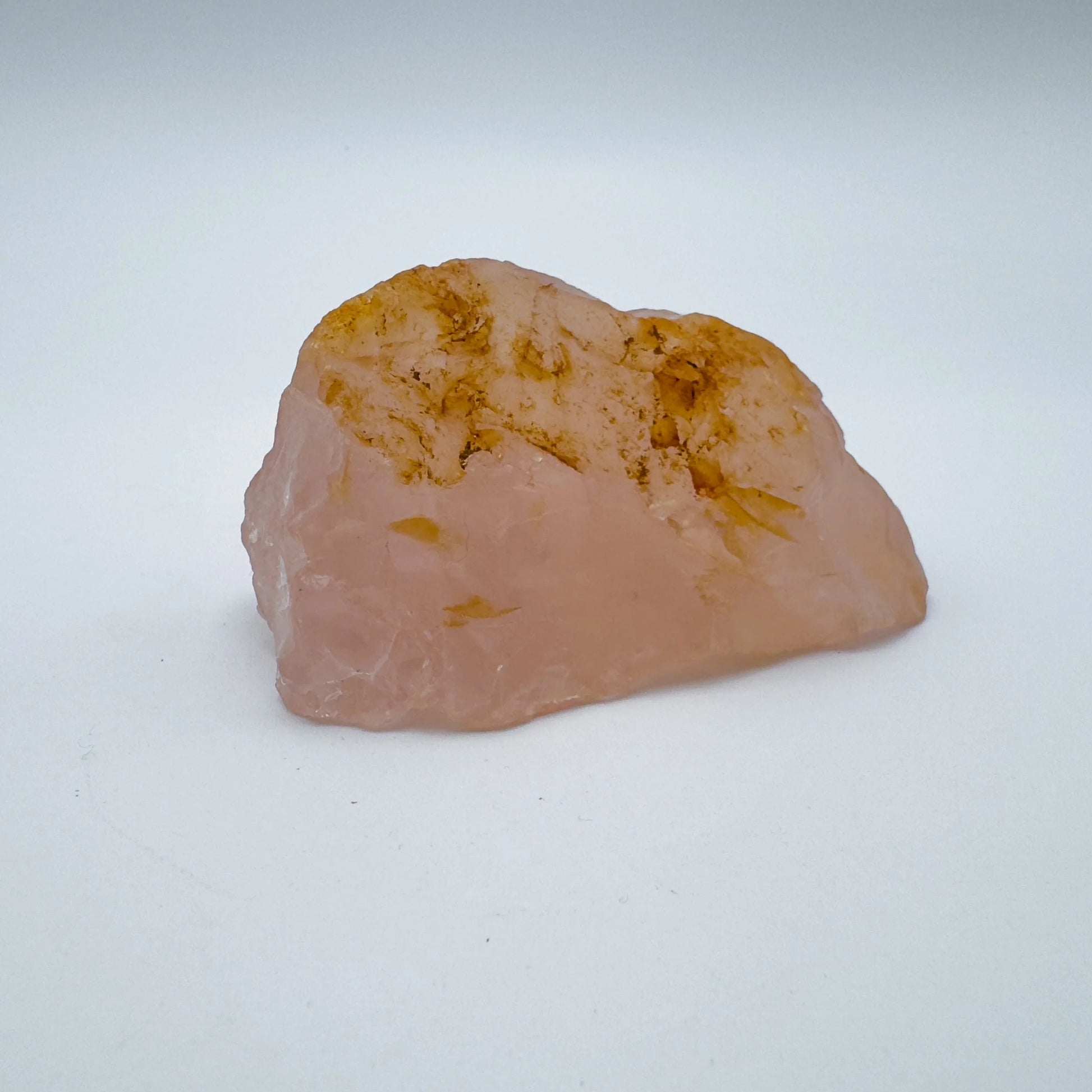 Scale comparison of Rose Quartz specimen, in the warmth of daylight.