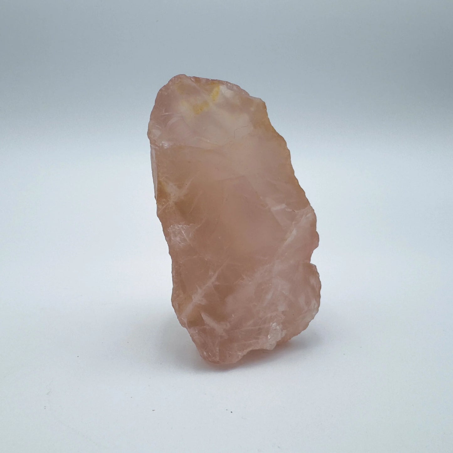 Back view of Grade AAA Rose Quartz specimen showing natural surface