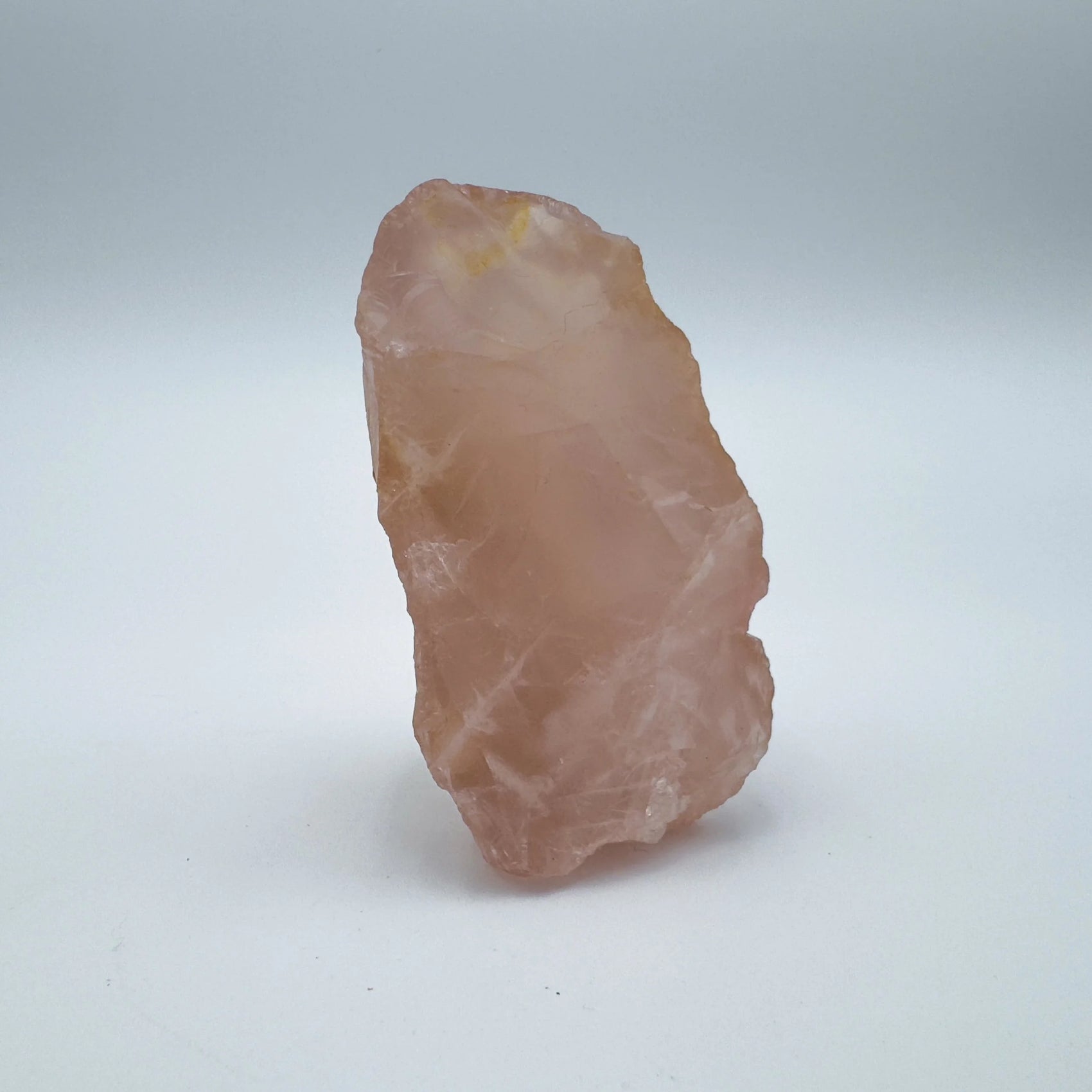 Back view of Grade AAA Rose Quartz specimen showing natural surface