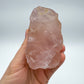 Detail shot of Grade AAA Rose Quartz specimen under natural light