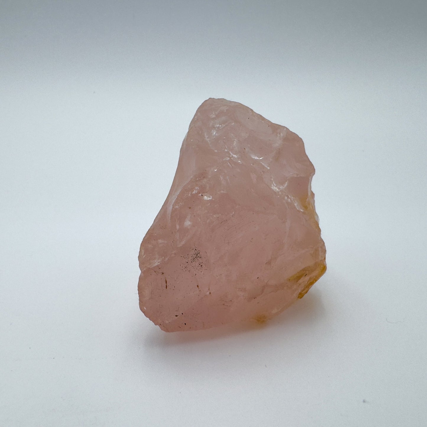Styled with natural light Rose Quartz specimen, associated with Stress Relief, shown in its everyday setting.
