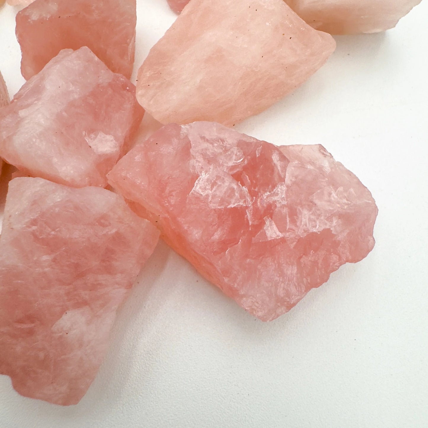 Edge-on view of Grade AA Rose Quartz raw stone, sourced from Namibia, kept near for Love and Self Love.