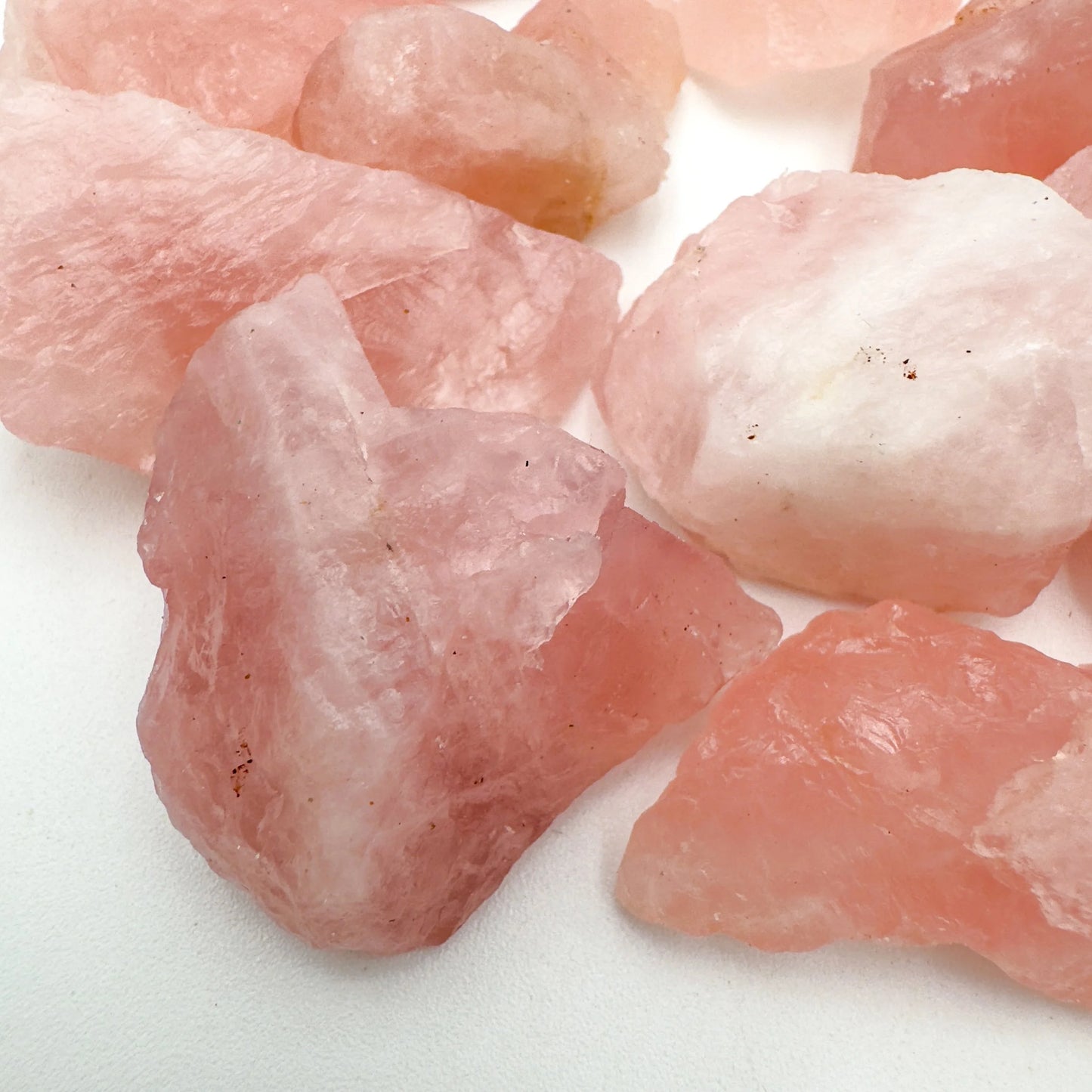 Looking down on Grade AA Rose Quartz raw stone, showing subtle veining, sourced from Erongo, Namibia.