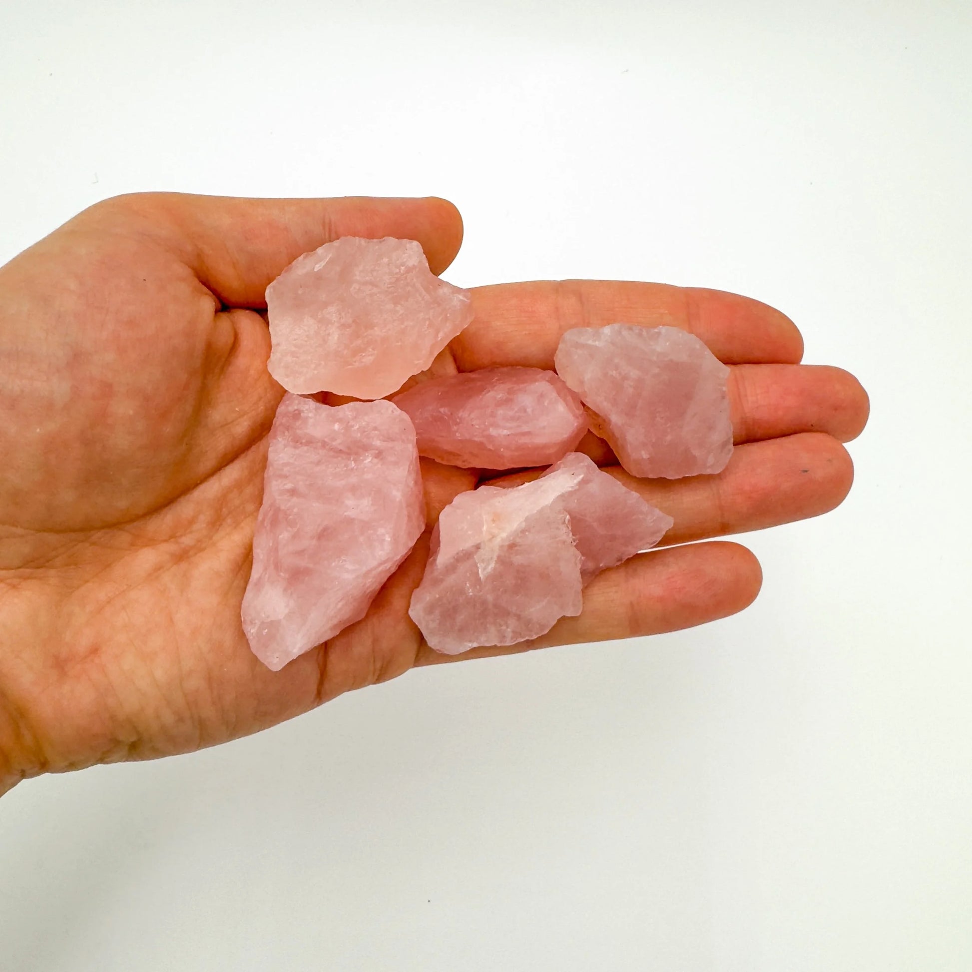 Back view of Grade AA Rose Quartz raw showing natural surface