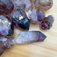 Tight crop of Smoky Amethyst raw point, sourced from Masvingo, Zimbabwe, showing subtle veining.