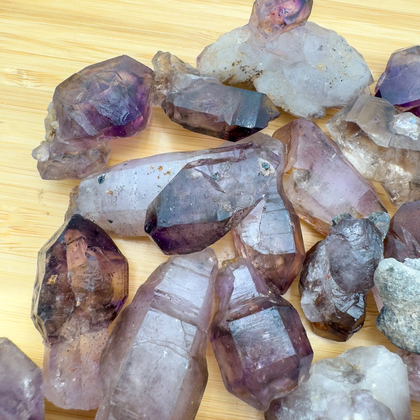 Top angle of Smoky Amethyst raw point, traditionally used for Grounding.