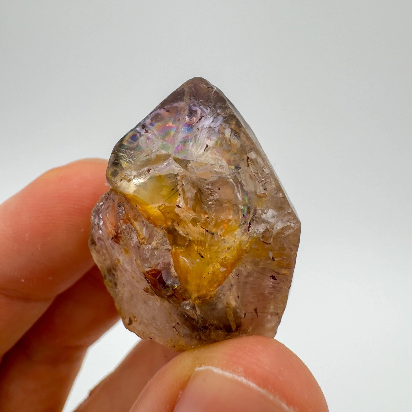 Back view of Grade A Smoky Amethyst point showing natural surface