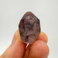Detail shot of Grade A Smoky Amethyst point under natural light