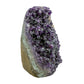 AA grade amethyst geode from Uruguay, left profile, a tan-brown base with green banding, specimen 50.