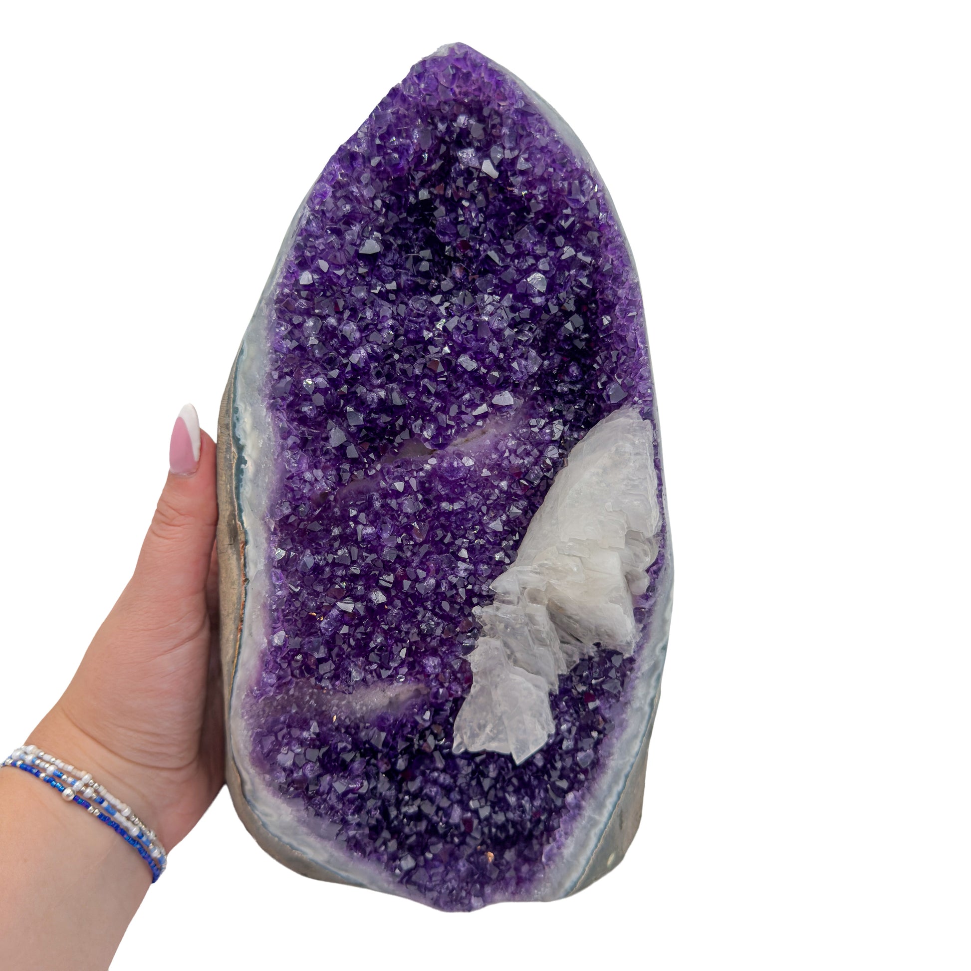 Amethyst polished geode from Uruguay held in an open hand, showing true scale, 11.39 pound tall cathedral, specimen 53.