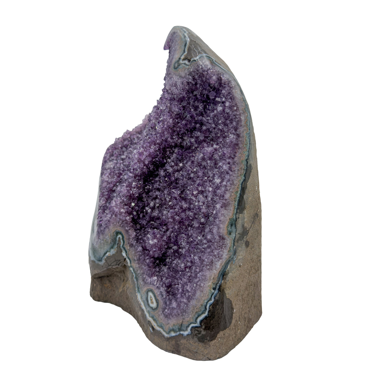 AA grade amethyst geode from Uruguay, right profile, a thick olive-brown basalt base with teal celadonite banding, specimen 41.