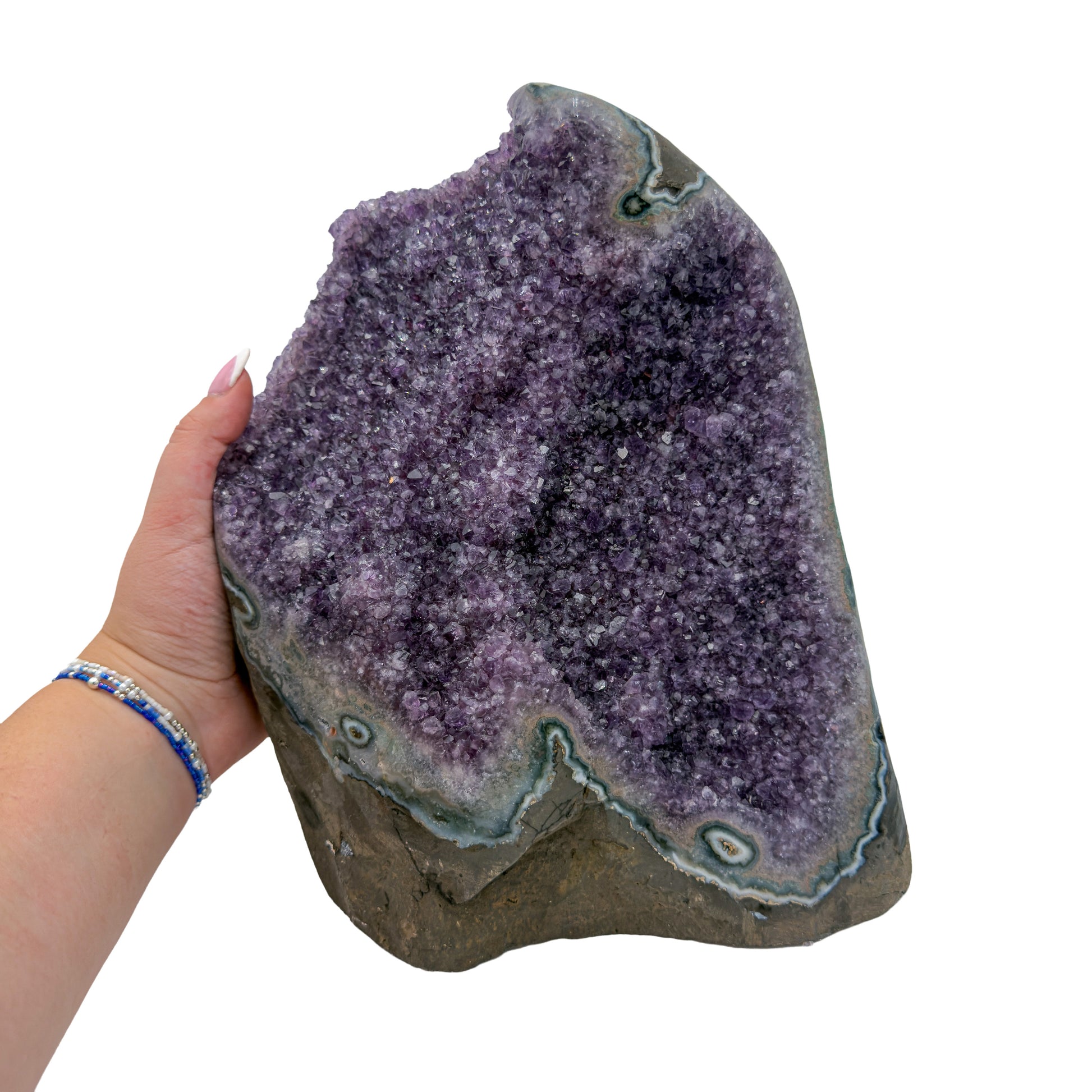Amethyst polished geode from Uruguay held in an open hand, showing true scale, 19.04 pound tall standing cathedral, specimen 41.