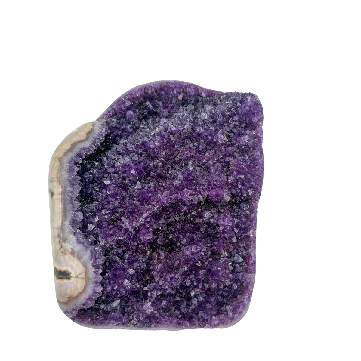 AA grade amethyst geode from Uruguay, angled three-quarter view, a cream and tan agate rim, specimen 23.