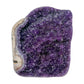 AA grade amethyst geode from Uruguay, angled three-quarter view, a cream and tan agate rim, specimen 23.