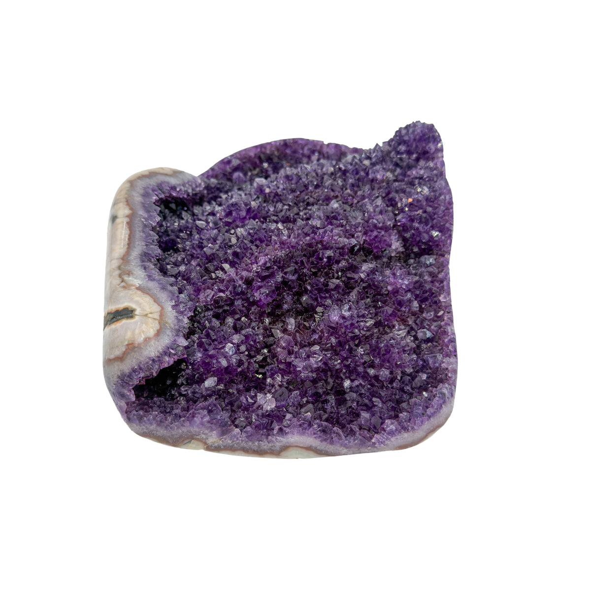AA grade amethyst geode from Uruguay, left profile, a cream and tan agate rim, specimen 23.