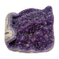 AA grade amethyst geode from Uruguay, left profile, a cream and tan agate rim, specimen 23.