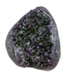 AAA grade amethyst geode from Uruguay, angled three-quarter view, pale green celadonite banding over a yellow-olive base, specimen 24.
