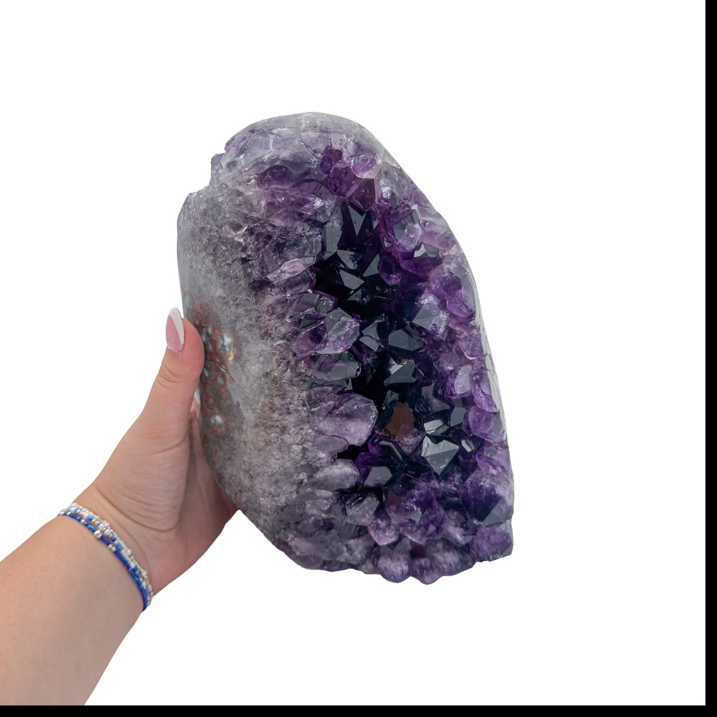 Amethyst polished geode from Uruguay held in an open hand, showing true scale, 10.88 pound tall narrow standing geode, specimen 60.