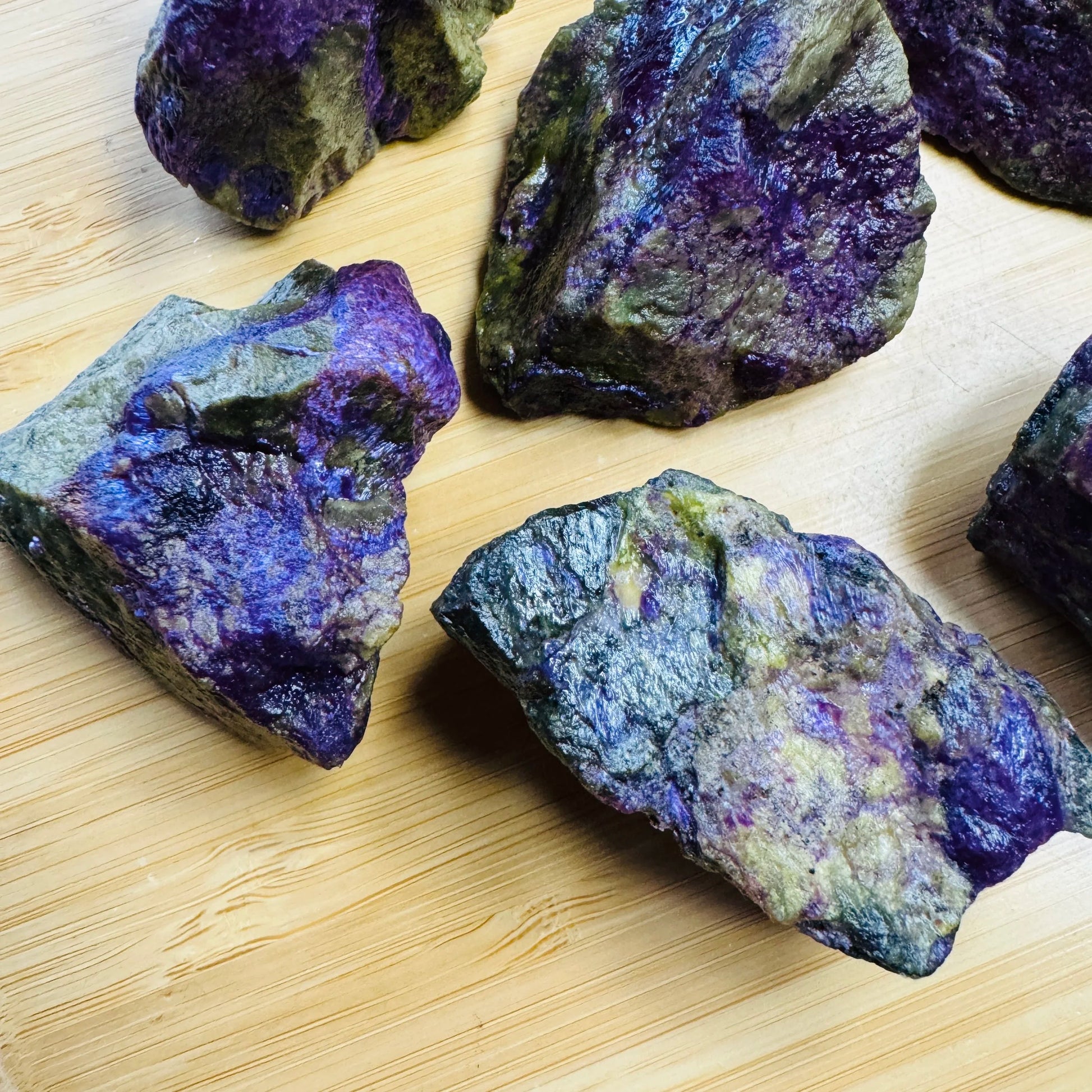 Side perspective of Stichtite raw stone, from Mpumalanga, South Africa, worked with for Emotional Healing.
