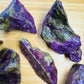 Top-side view of Stichtite raw stone, showing natural banding, kept near for Emotional Healing.