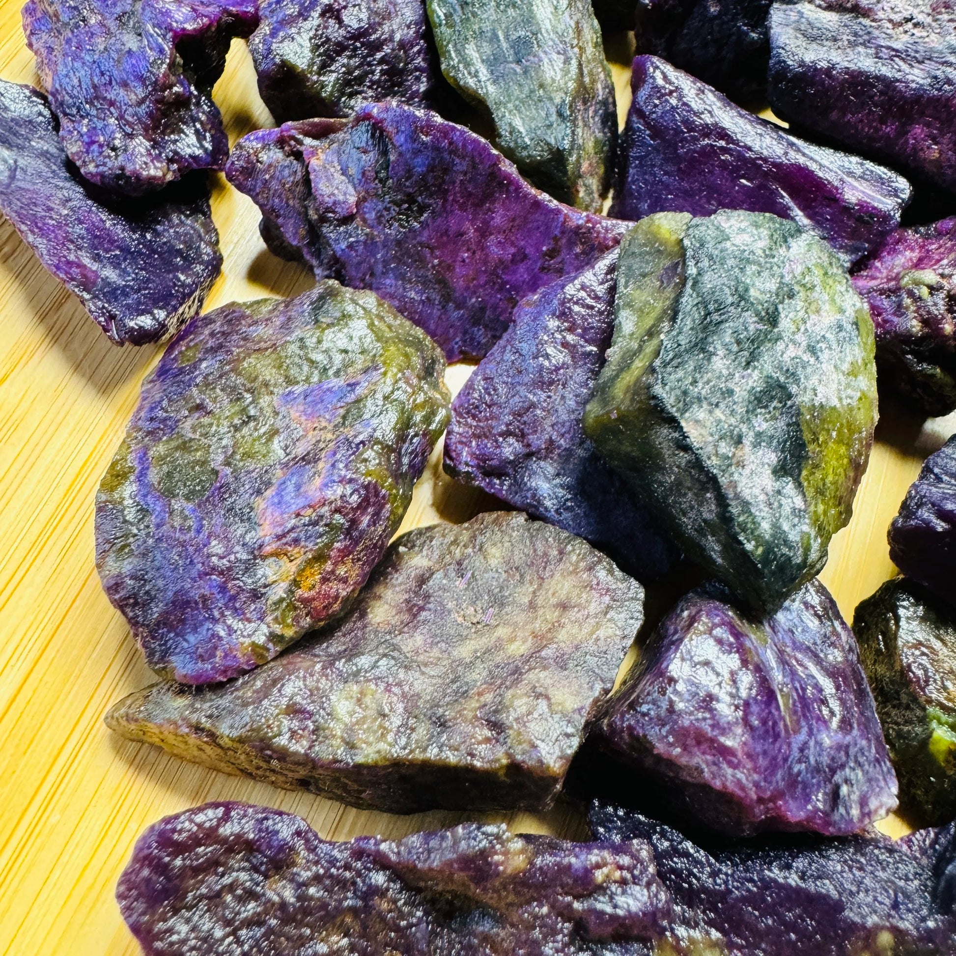 Side perspective of purple Stichtite raw stone, showing honest grain.