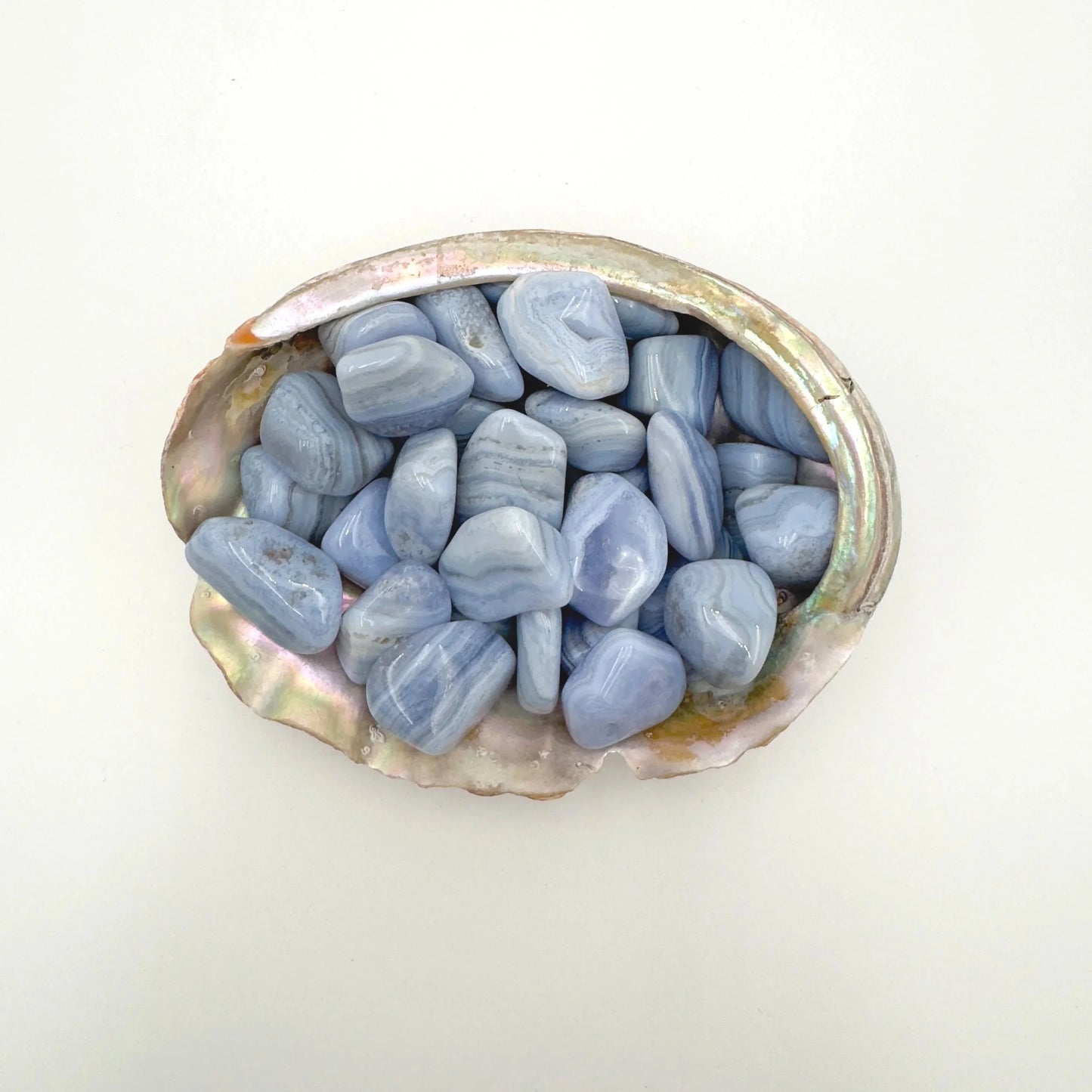 Detail shot showing Blue Lace Agate tumbled stone, for Stress Relief, showing earthy tone.