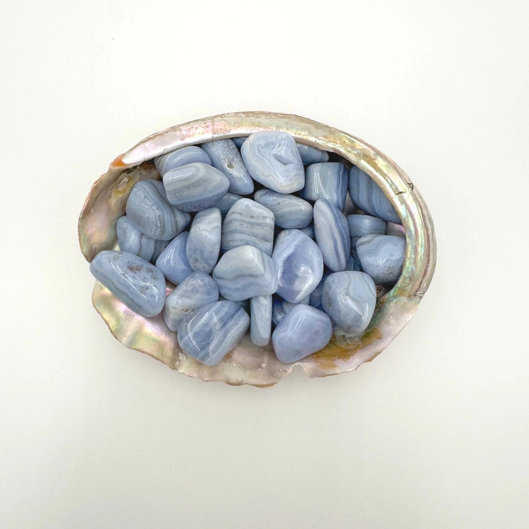 Detail shot showing Blue Lace Agate tumbled stone, for Stress Relief, showing earthy tone.
