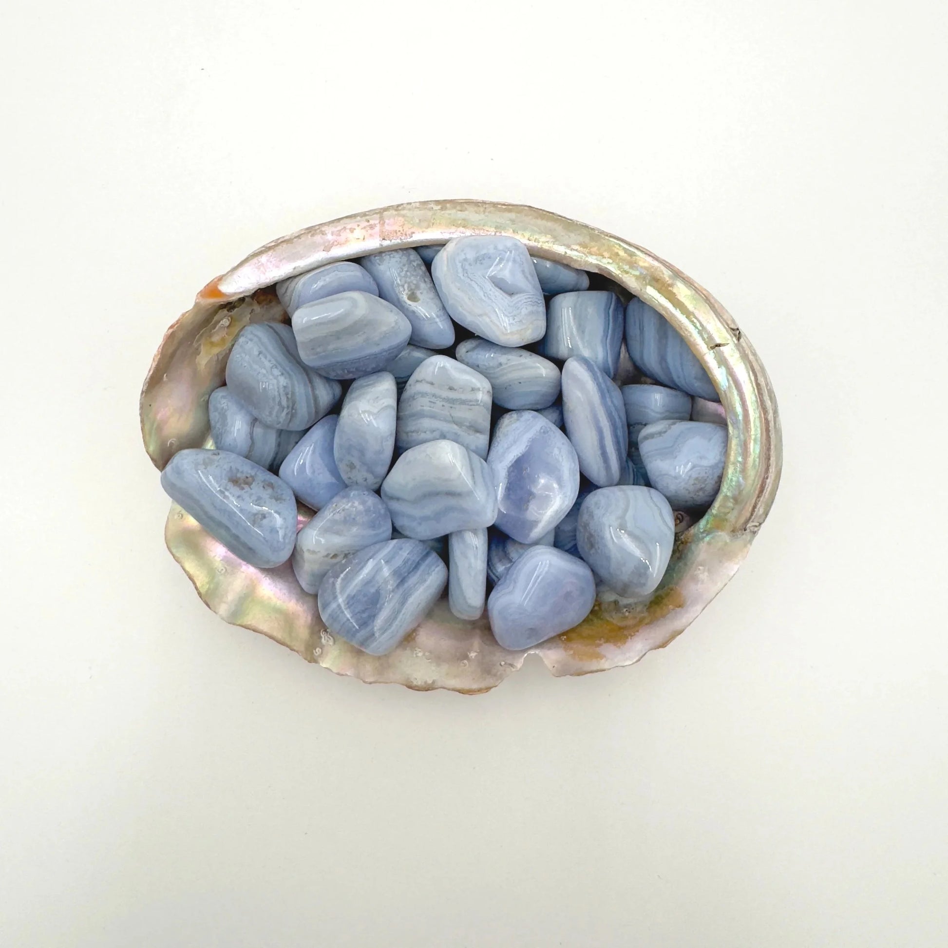 Detail shot showing Blue Lace Agate tumbled stone, for Stress Relief, showing earthy tone.