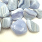 Reverse angle of Blue Lace Agate tumbled stone, turned to for Stress Relief, from ǁKaras Region, Namibia.