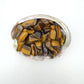 Macro view of Grade A Tiger Eye tumbled stone, showing natural inclusions.