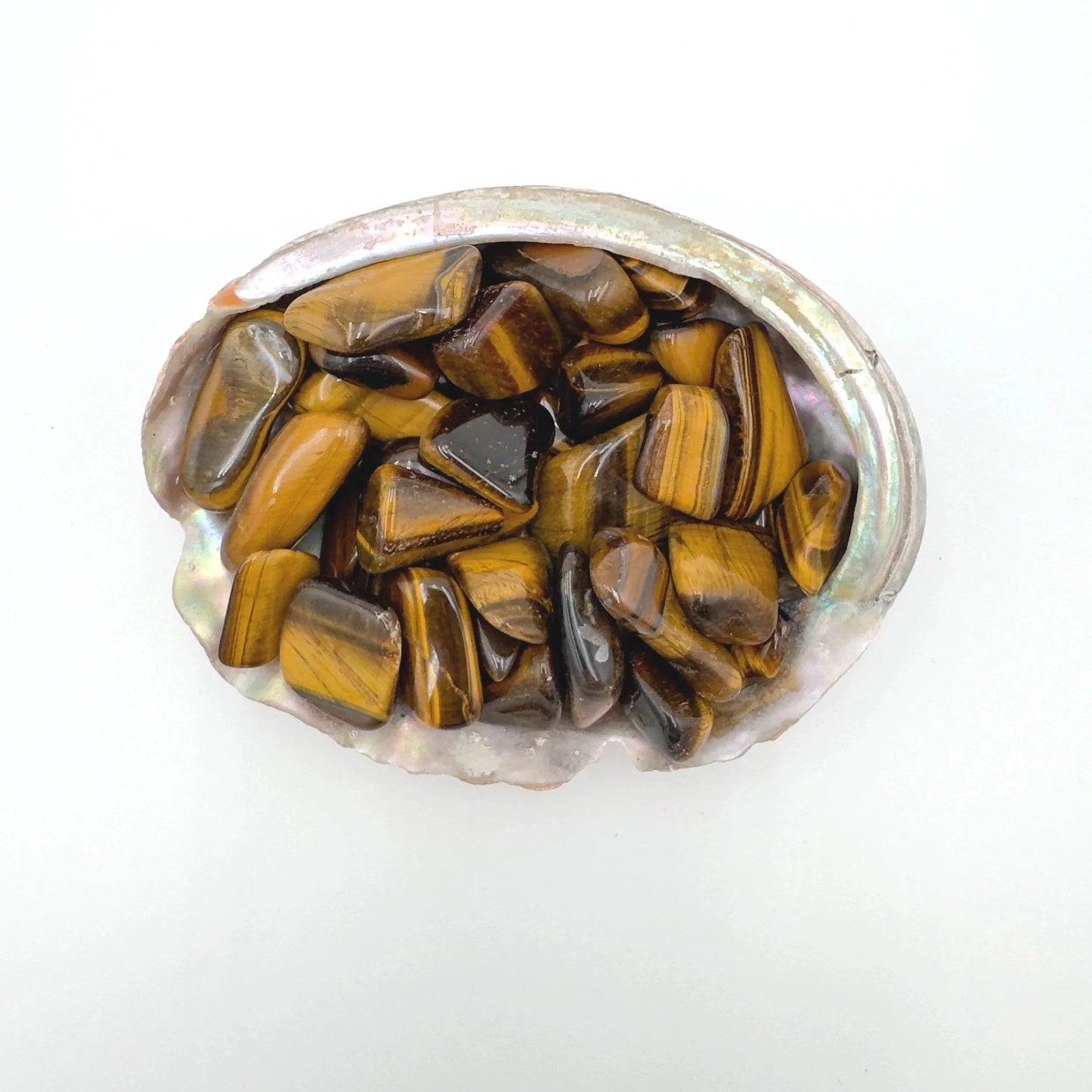 Macro view of Grade A Tiger Eye tumbled stone, showing natural inclusions.