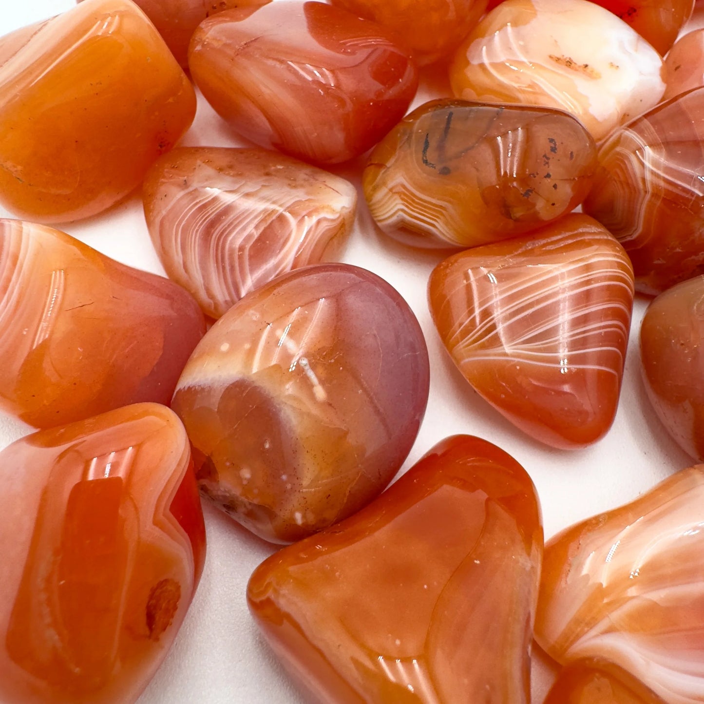 Alternate angle of Grade AA Carnelian tumbled stone showing overall shape