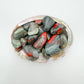 Detail of Grade AA Bloodstone tumbled stone, carried for Energy and Protection.