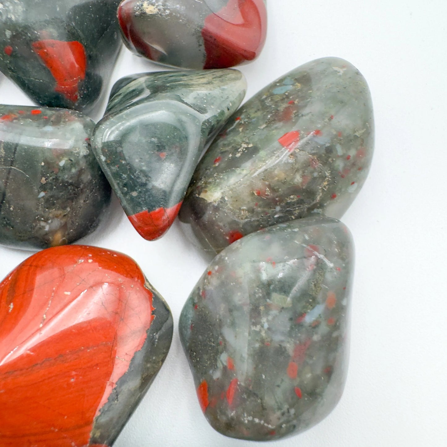In context of a Bloodstone tumbled stone, from Hhohho, Eswatini, often kept for Confidence, showing natural surface character.