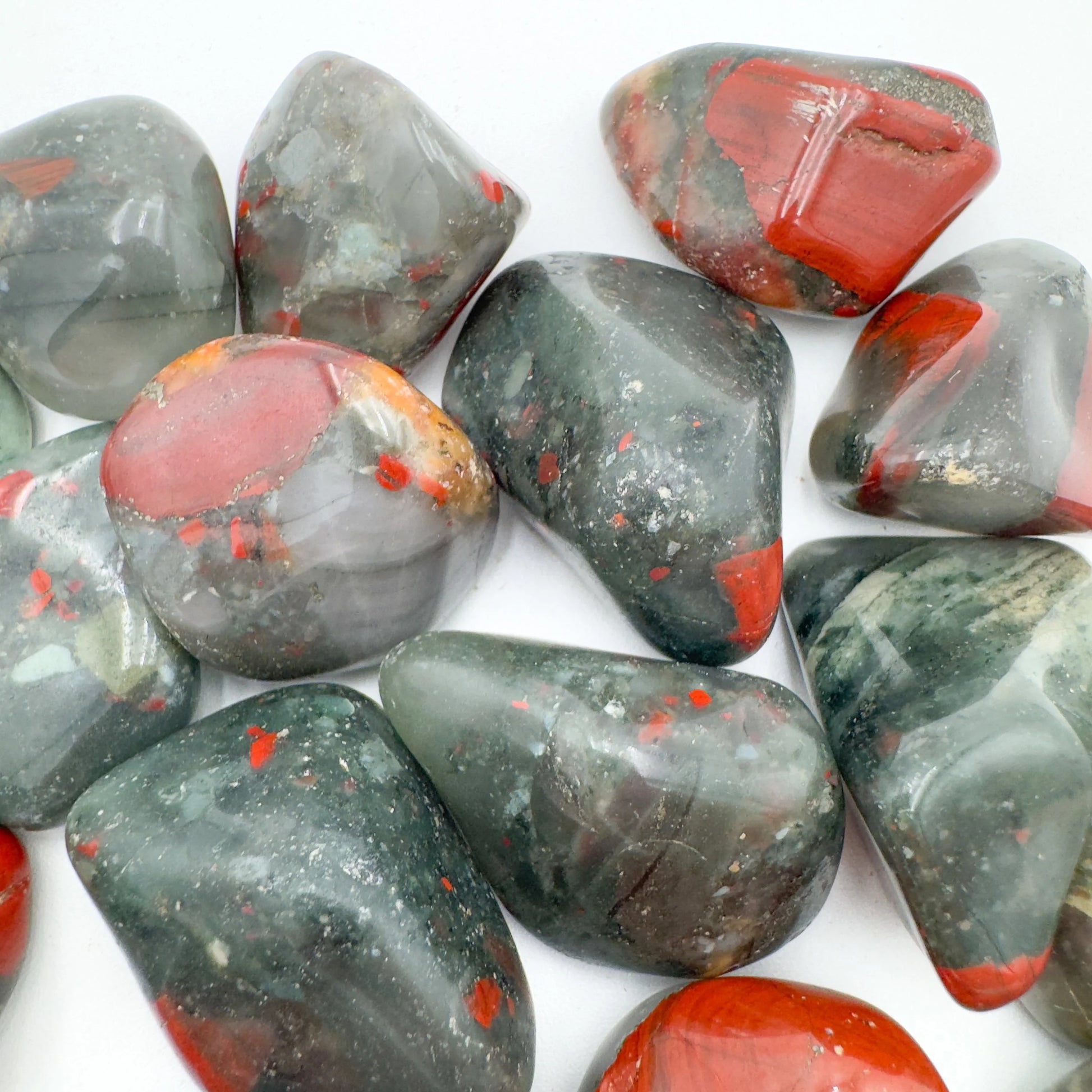 Back view of Grade AA Bloodstone tumbled stone showing natural surface