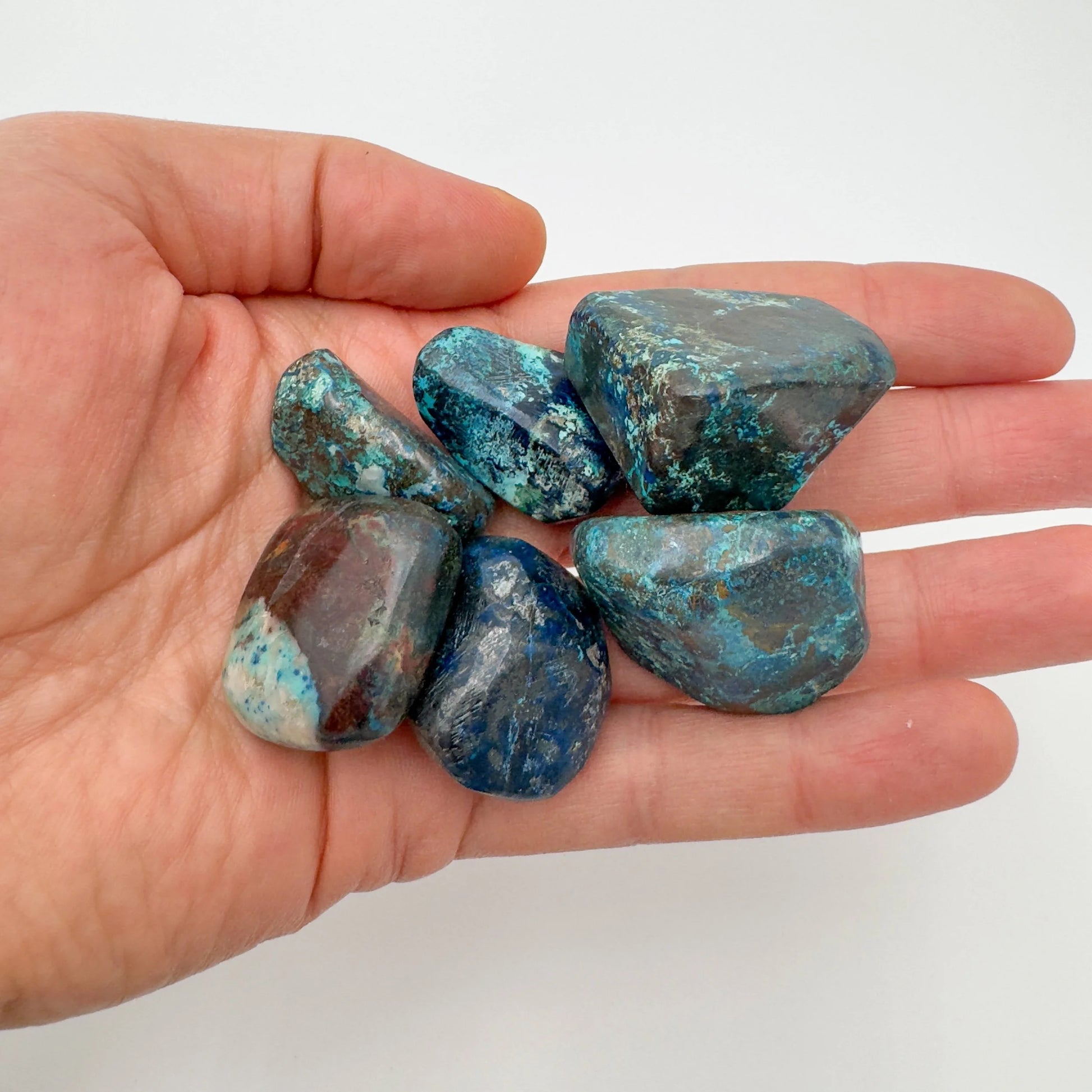 Lifestyle view of a Azurite tumbled stone often worked with for Intuition, sourced from Kunene, Namibia.