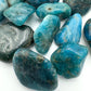 Hand-held view of a Apatite tumbled stone to support Focus, sourced from Anosy, Madagascar.