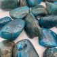 Back view of Grade AA Apatite tumbled stone showing natural surface