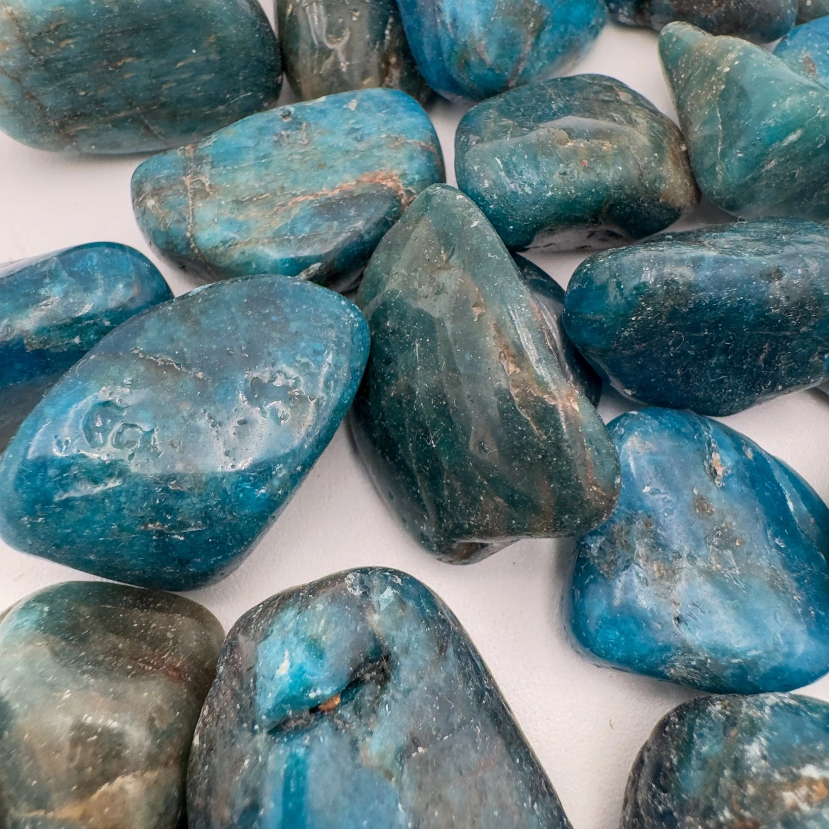 Back view of Grade AA Apatite tumbled stone showing natural surface