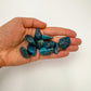 Detail shot of Grade AA Apatite tumbled stone under natural light