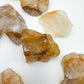 Profile shot of yellow Golden Healer raw stone, often paired with practices around Healing and Meditation, from Madagascar.